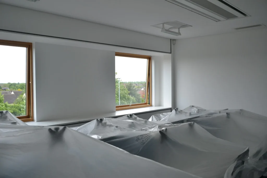 Commercial painters and decorators working on a London office interior