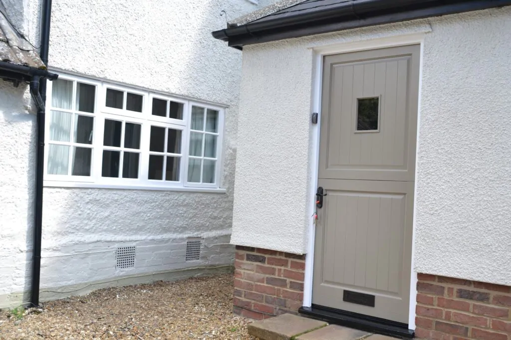 Exterior of a house being spray-painted in Surrey