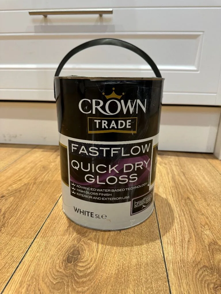 A tin of white quick-drying gloss on a kitchen floor
