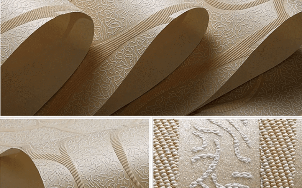 Close-up view of textured beige wallpaper with embossed, swirling patterns and a subtle sheen—an elegant showcase of current wallpaper trends, presented in both rolled and flat sections.