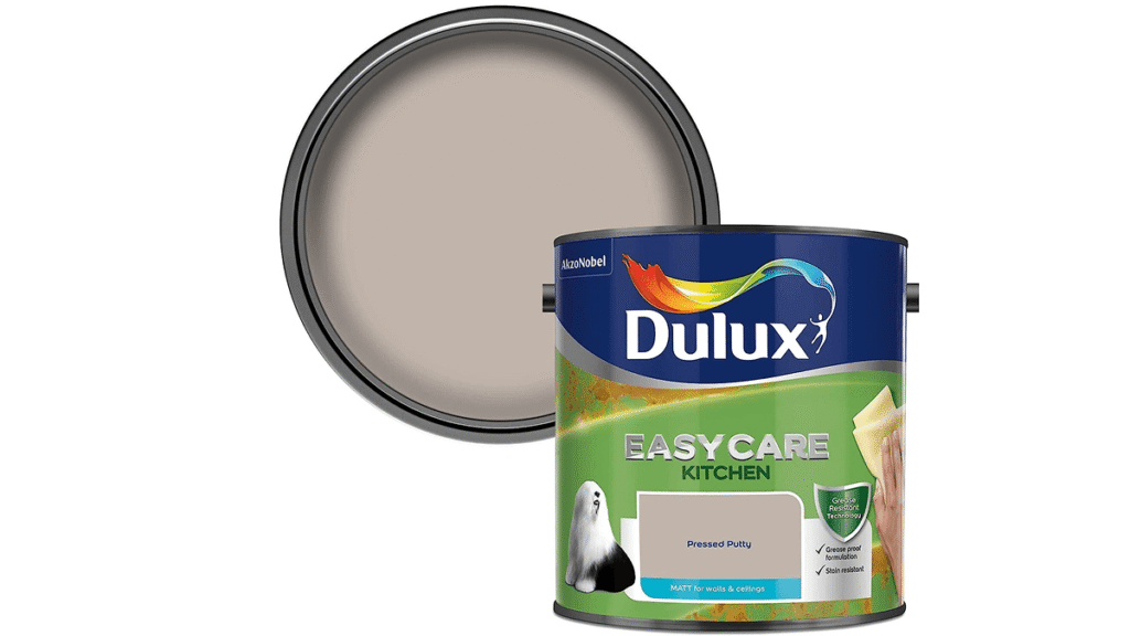 A Dulux EasyCare Kitchen paint tin in the shade "Pressed Putty" is shown with the lid off, revealing the beige paint inside—perfect for giving your kitchen a fresh look and an instant energy rating boost.